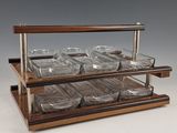 an image of a display of glass dishes on a wooden stand