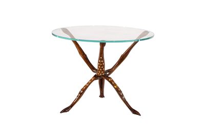 a glass table with metal legs and a glass top