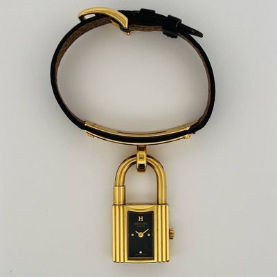 an image of a gold plated watch with a padlock on it