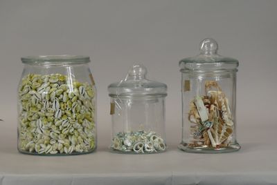 three glass jars filled with different types of food