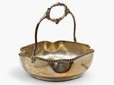 silver plated bowl with handle and handles on a white background