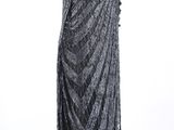 a black and white photo of a dress on a mannequin mannequin