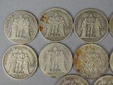 six different types of silver coins are shown on a white surface