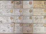 many different types of stamps on a wooden table with a black background
