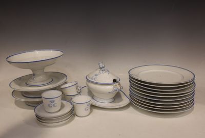 a lot of plates and bowls that are on the table