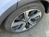 a close up of a car tire on the road