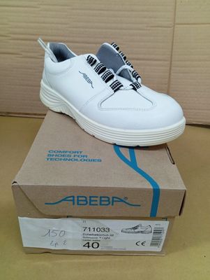 an image of a pair of white shoes sitting on top of a box