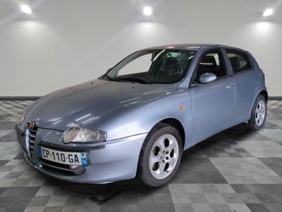 a picture of a silver car parked in a garage