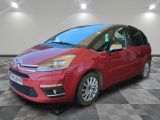 the red citrole is parked on a checkered tile floor