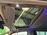 the interior of a car with the sunroof down and a view of the roof