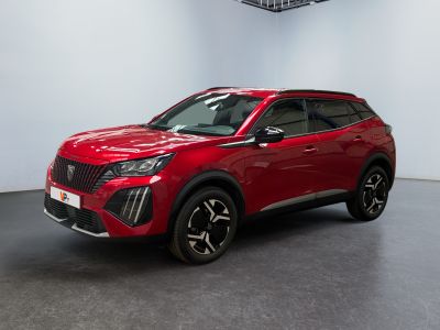 a red suv is parked in a large room