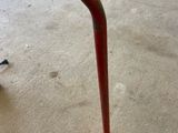 a close up of a baseball bat that is on the ground