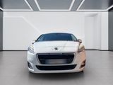 a close up of a white car in a large room