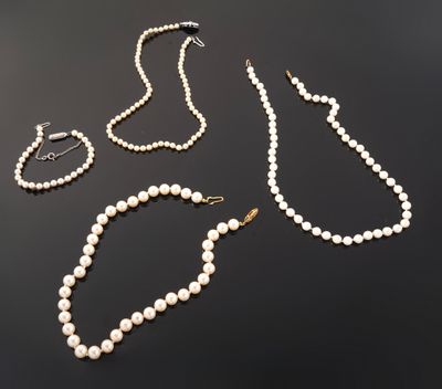 a collection of pearl necklaces, bracelets and broocher