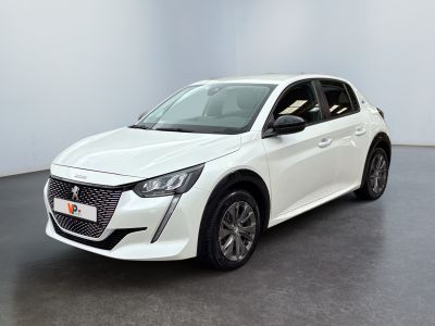 a white car is parked in a room with a black floor