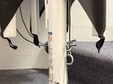 an umbrella that is attached to a pole on the floor