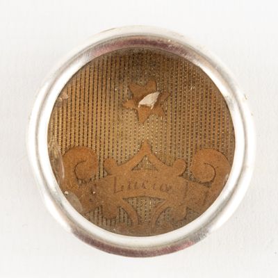 a silver ring with a picture of a horse and a bird on it