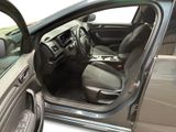 the interior of a car with the door open and the driver ' s seat down