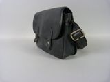 black leather cross body bag on white background with white background