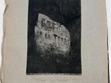 a black and white photo of an old building in the woods