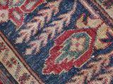 a cat that is laying on a rug on the floor