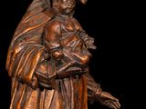 an image of a statue of a woman holding a child