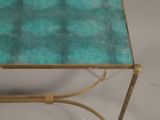 a small table with a glass top on a white surface