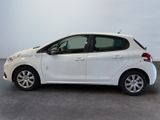 a picture of a white car that is parked in a garage