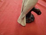 a figurine of a bird sitting on a table