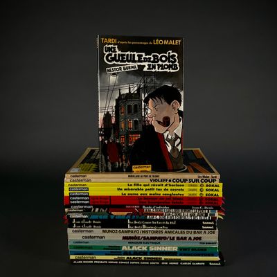 books stacked on top of each other on a black surface