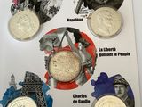 four different types of coins are shown on a magazine cover