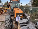 a tractor that is sitting in the dirt