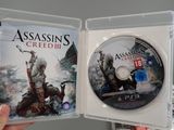 someone is holding a video game in their hand and a dvd in the other hand