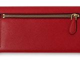a red leather wallet with a zipper on the front