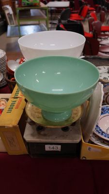 several bowls and plates are stacked on top of each other on a table