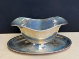 a silver plate with a saucer and a saucer on it