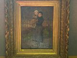 une peinture ancienne représentant une femme tenant un enfant dans ses bras