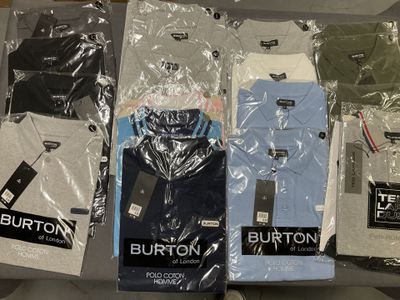 a lot of men ' s shirts on display in a store