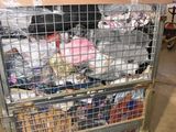 a metal cart with many items in it in a warehouse