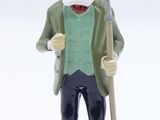 a figurine of a man with a hat and a cane