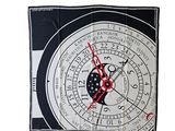a black and white clock with red hands on a white background