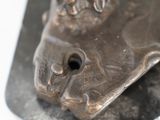 a close up of a metal sculpture of a horse ' s head