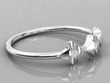 a close up of a diamond ring on a reflective surface