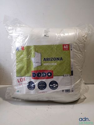 the pillow is wrapped in plastic and sitting on the counter