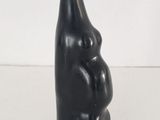 a black sculpture of a man and a woman