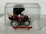 a small model of a car in a clear box