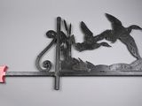 two birds on a branch with an arrow in the middle