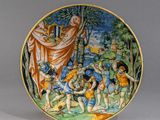 une image représentant une assiette sur laquelle est peinte une scène biblique