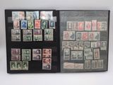 a lot of stamps in a folder on the table