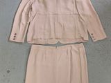 beige jacket and skirt with buttons on the back of the jacket
